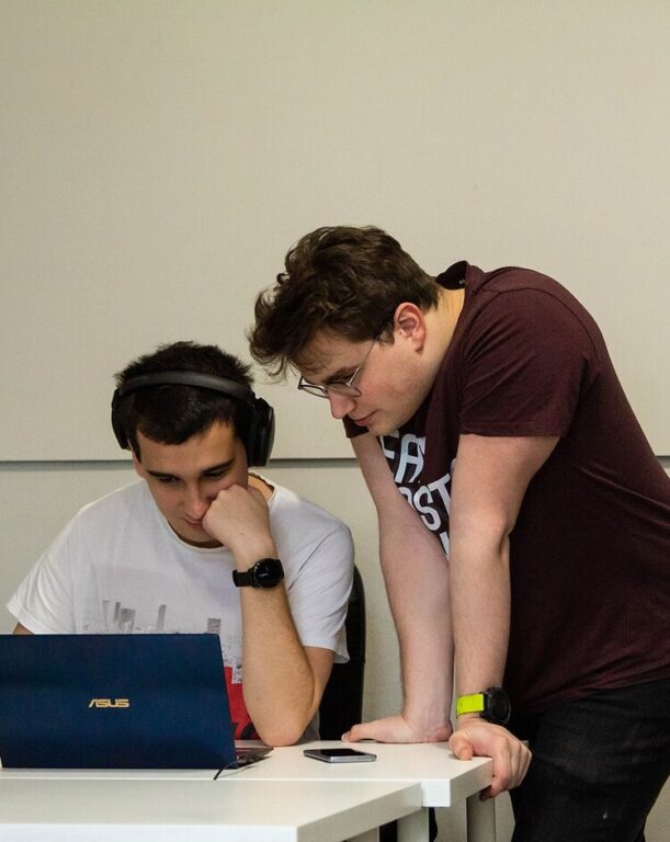 Web development for agencies - developers discussing the website code structure