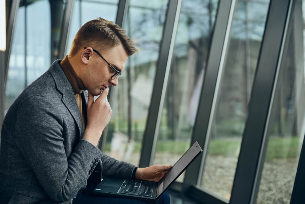 Web development for agencies - man browsing the web page
